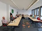 Foto: Forschungsprojekt TEK, Werkstatt, Teilnehmende an Tischen