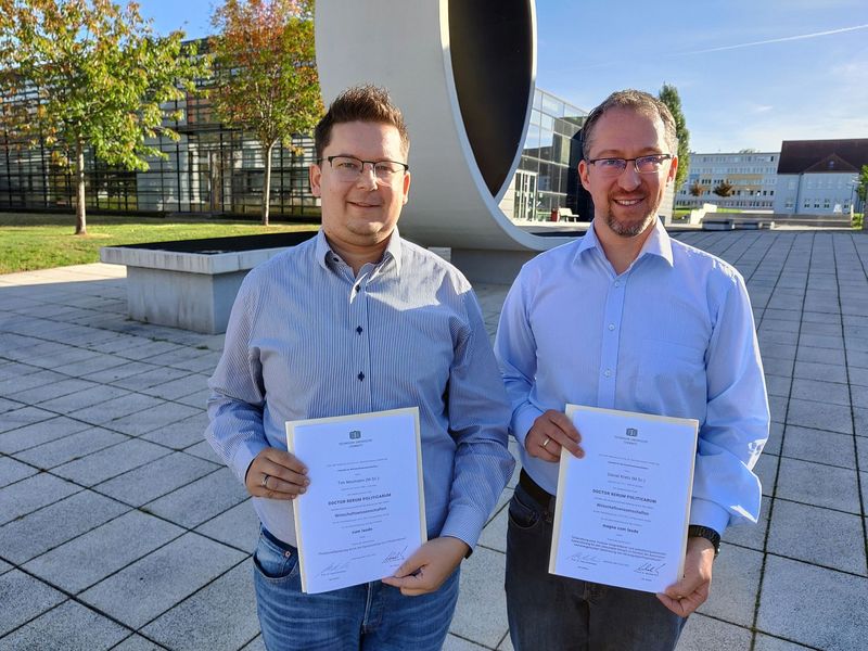 Dr. Tim Neumann und Dr. Daniel Kretz 